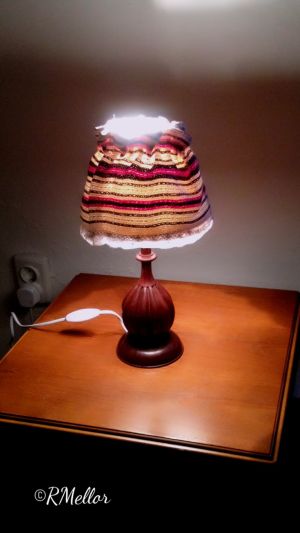 A lamp with a traditional shade.